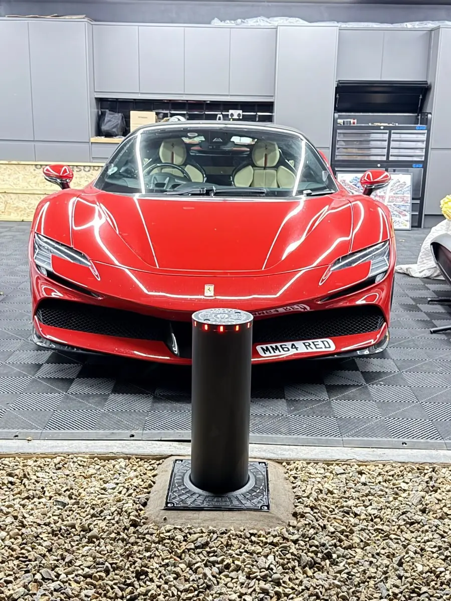 Ferrari protected by a rising bollard