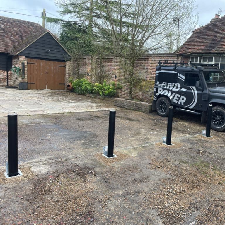 land rover parked next to bollards