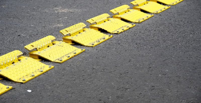 yellow traffic flow plates on road
