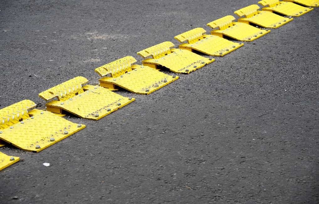 yellow traffic flow plates on road