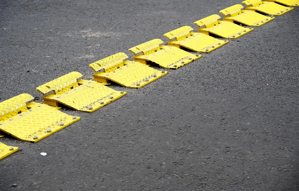 yellow traffic flow plates on road